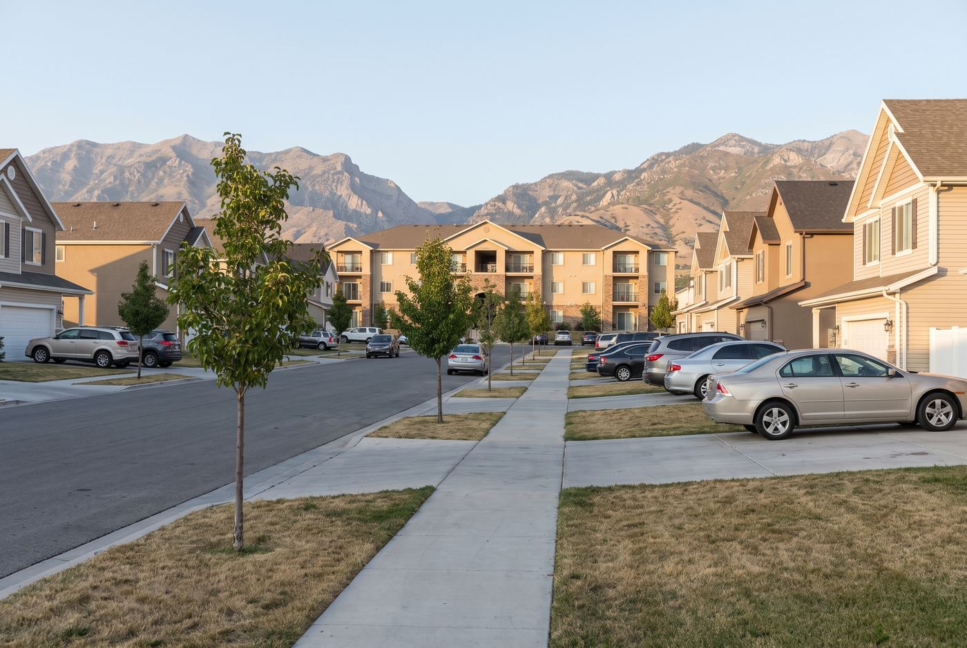 A suburban street with an apartment complex